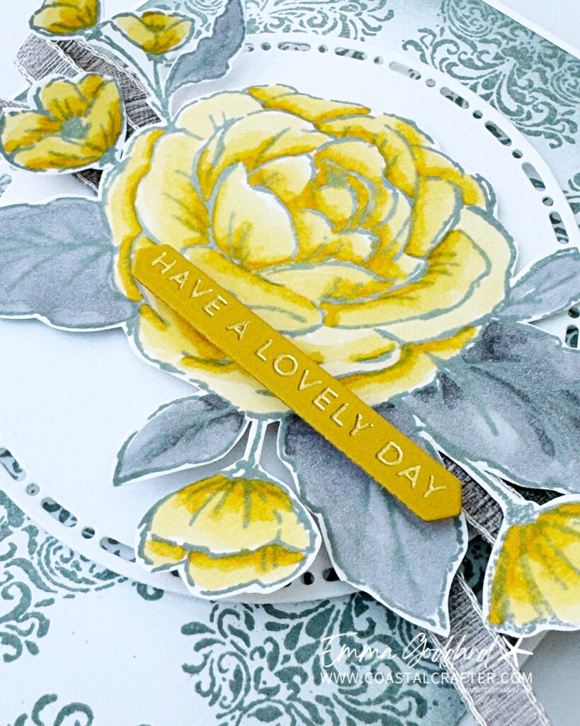Handmade card featuring a large Daffodil Delight rose with Smoky Slate leaves coloured with Stampin' Blends, made using the Sweetly Sentimental and Echoes of Details focus products. The rose sits on a white stitched circle die cut over a Smoky Slate damask patterned background, with Grey Granite linen ribbon and a Crushed Curry sentiment strip reading 'have a lovely day', hot foiled."