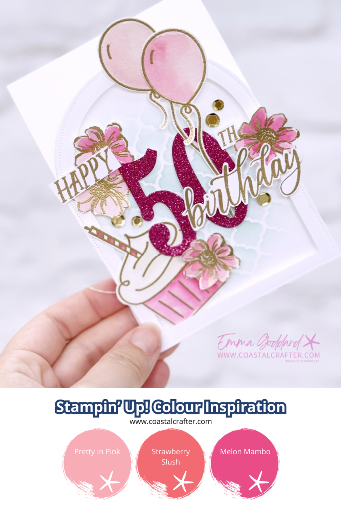 Handmade 50th birthday card in pink, white, and gold tones. The card features a glittery pink number "50" with "Happy" and "Birthday" written in gold script. Decorative elements include pink watercolour flowers, gold sequins, pink balloons, a cupcake, and a soft blue stencil background. The card is arranged in an easel style with layered embellishments and a glittery pink strip at the base. Designed by Emma Goddard, as indicated by the watermark.