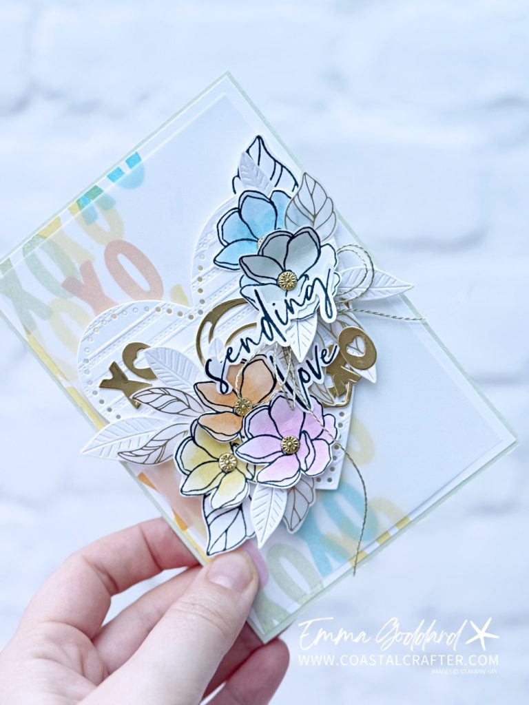 Pastel Valentine’s card with die cut heart, stamped background and vellum layer